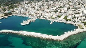 Aerial drone bird's eye view video of famous seaside town of Karystos in South Evia island, Greece