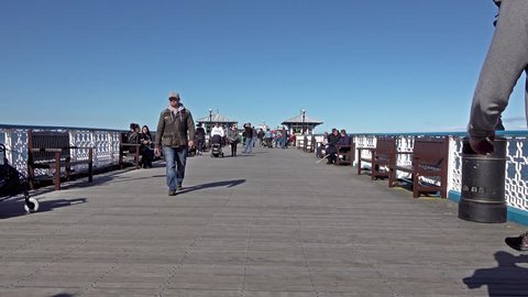 Llandudno / Wales - April 22 2018: Folks enjoying the longest pier in Wales.