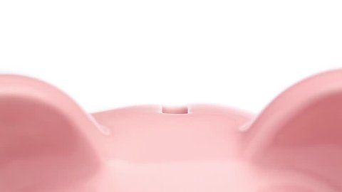 Piggy Bank being filled Vídeo Stock