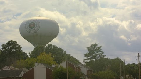 Time lapse shot of water tower in Jackson Mississippi, and of clouds rolling behind it in the sky