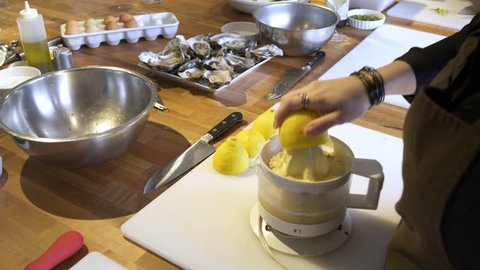 Chef using a lemon squeezer machine