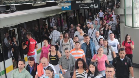Medellin, Colombia - May 1, 2018: Crowd disembarking from Medellin metro during rush hour