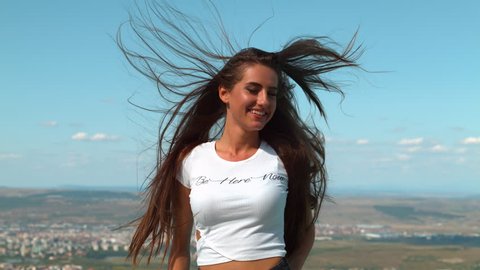 Wind blowing through a young woman's hair