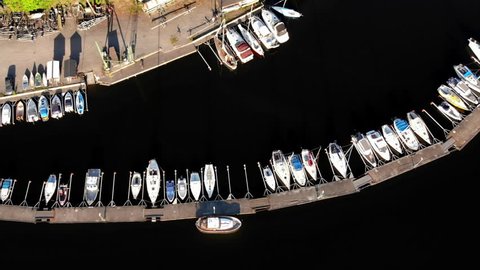 Aerial footage of the Stockholm island Stora Essingen and one of its lake marinas.
