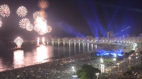 Rio de Janeiro, Brazil - January 1st, 2018: Revellers, both locals and tourist, enjoy the breath-taking New Years fireworks display along Copacabana Beach, Rio de Janeiro, Brazil