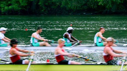 Philadelphia, PA / USA - 5/11/2018: Dad Vail Regatta, group of eight person oared rowing boat race over river