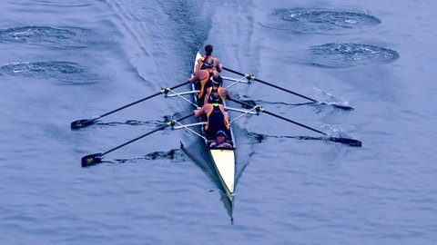 Philadelphia, PA / USA - 5/11/2018: Dad Vail Regatta, group of four person oared rowing boat race over river