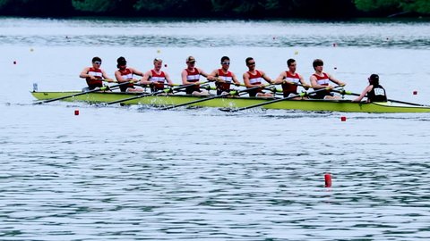 Philadelphia, PA / USA - 5/11/2018: Dad Vail Regatta, group of eight person oared rowing boat race over river