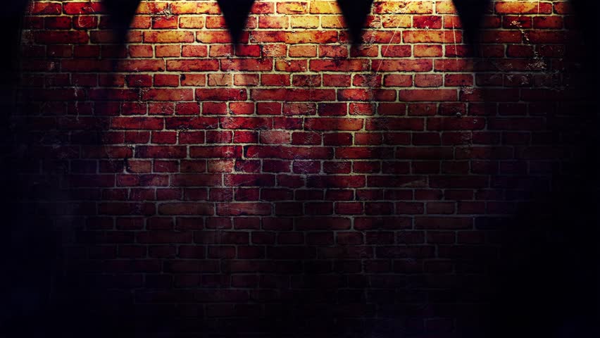 Footage of red brick wall with spotlights