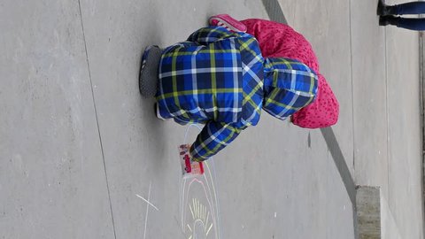 Vertical video. Children draw in front of MAXXI. Rome, Italy - February 21, 2015: is a national museum of contemporary art and architecture