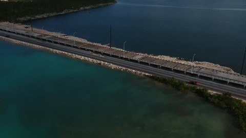 Aerial view of construction of new Fishing hole road bridge in Freeport, Grand Bahamas with traffic on the old road