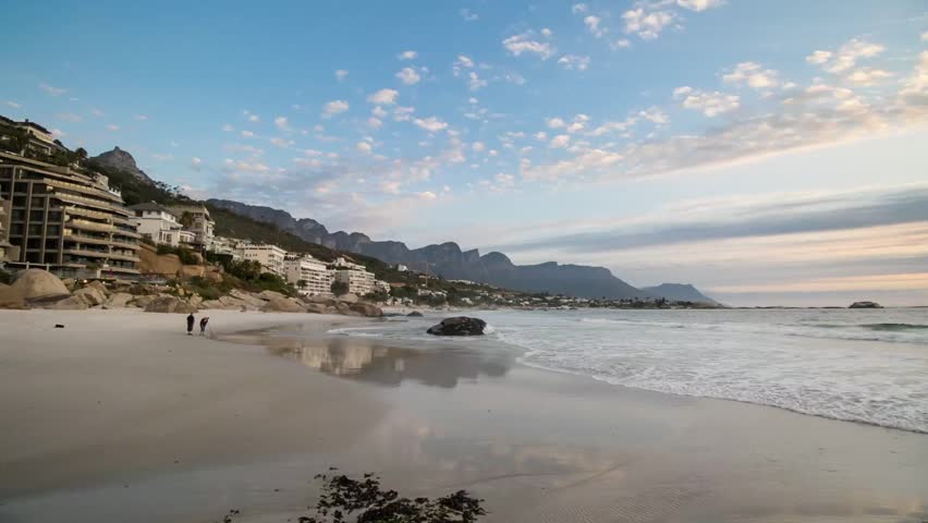 Timelapse of Clifton cape town view from first beach at dusk time with waves rolling in on the blue flag status beach