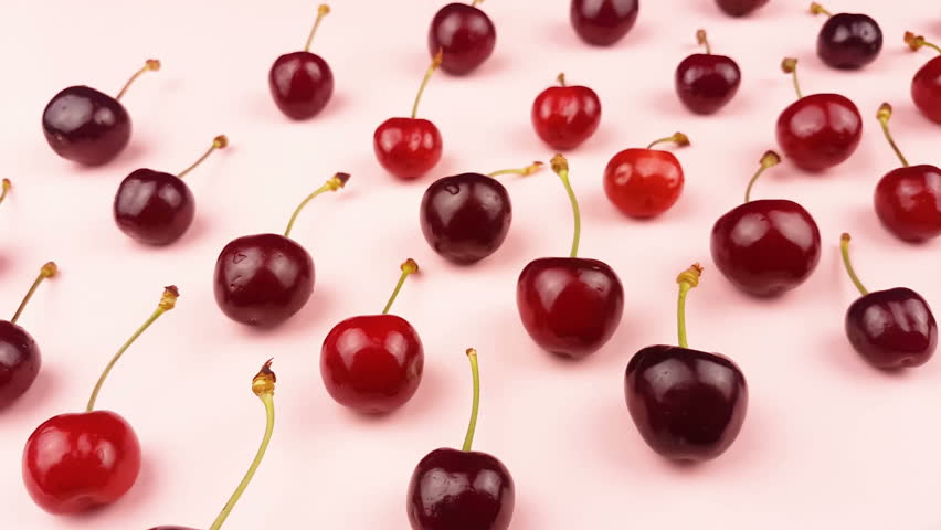Sweet fresh cherry on pastel pink background. | Shutterstock HD Video #1011324152