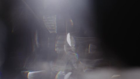 Real Lens Flare that is Easy to Use in Blend / Overlay Modes. Leaking Reflection of a Glass / Crystal Making Colorful Abstract Prism Figures.  Shot on RED EPIC-W 8K Helium Cinema Camera.