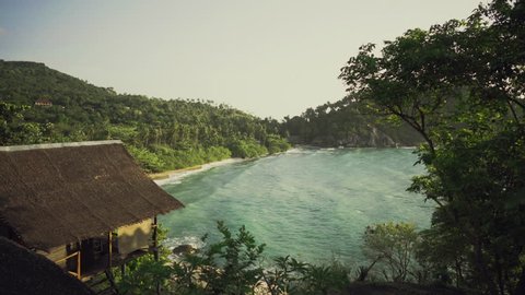 Aerial Footage of Beautiful Bay with Big Oceanic Waves and Luscious Jungle Hills on the Shore. Hut Visible. Shot on 4K UHD Camera.
