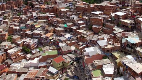 Aerial view of Comuna 13 slums in Medellin, Colombia. Once one of the most dangerous neighbourhoods in Colombia, the Comuna 13 reinvented itself in recent times and is now considered safe to visit.