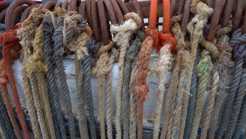 Colorful ropes hanging on a fishing boat