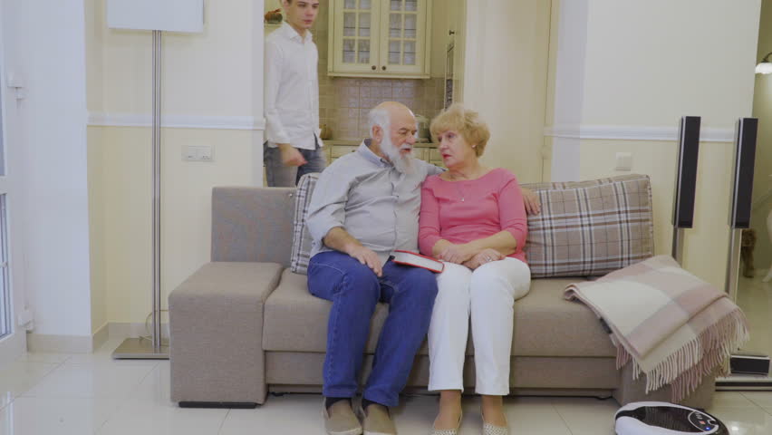 Grandson hugs grandparents