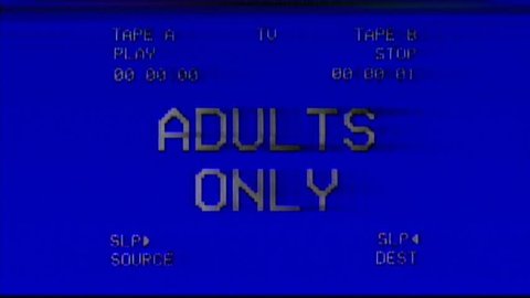 Analog capture (intentional heavy distortion fx): an old damaged VHS tape tracking a bad signal coming from a double deck, with the text Adults only.
