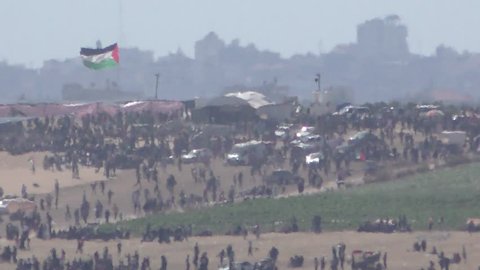 Palestinians near the Israeli border protest and demonstrate in commemoration of Nakba Day or Day of Catastrophe. Beit Hanoun in Gaza Strip. May 14, 2018, 2Km distance.