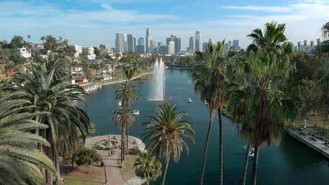 Los Angeles, California, USA - April 20, 2018 : Aerial Shot of Los Angeles Downtown Skyline Over Palm Trees and Lake in Echo Park