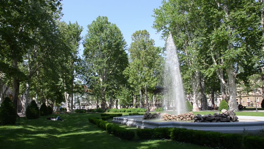Park Zrinjevac in downtown Zagreb in spring. Fountain in green park. Zagreb is the capital and the largest city of Croatia.