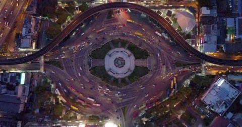 4K. Aerial view of huge roundabout and traffic lights at Victory Monument during the night time. Landmark of Bangkok, Thailand