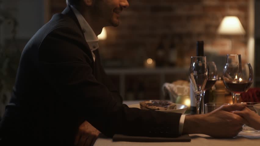 Romantic happy loving couple having a dinner date, they are holding hands and talking, feelings and relationships concept Royalty-Free Stock Footage #1011354530
