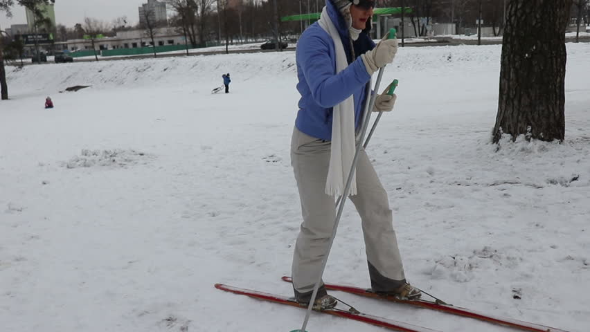 Active woman spending her leisure with active skiing