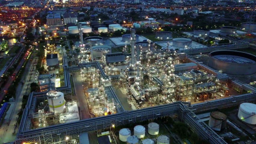 4K Night time aerial shot from oil tanks in a refinery Royalty-Free Stock Footage #1011363734