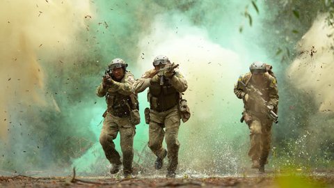 Military men in action on the battlefield, slow motion