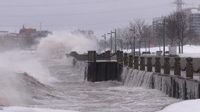 Huge powerful waves breaking at seawall in major severe storm in hurricane force winds - Powered by Shutterstock - Get 15% off with code: PIKWIZARD15