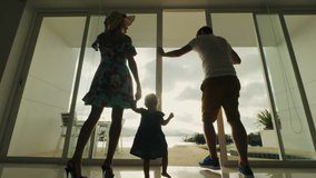 Family returning to hotel room after walk. Family couple with child coming out at balcony resort hotel with beautiful view on sea beach - Powered by Shutterstock - Get 15% off with code: PIKWIZARD15