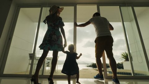 Family returning to hotel room after walk. Family couple with child coming out at balcony resort hotel with beautiful view on sea beach