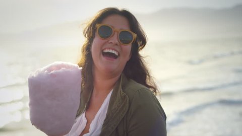 Portrait Of Happy Young Woman Eating Cotton Candy On Santa Monica Pier (Shot On Red Scarlet-W Dragon In 4K, Slow Motion)