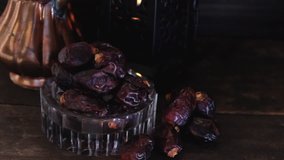 Dried date fruits in low light. Selective focus.