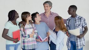 Teacher speaking to the multi ethnic classroom, isolated on white background. - Powered by Shutterstock - Get 15% off with code: PIKWIZARD15