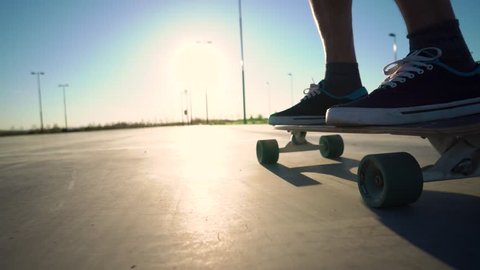 skateboarder legs skateboarding at city