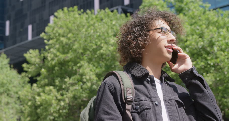 Young man talking on the mobike phone 4k