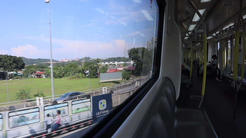 KUALA LUMPUR, MALAYSIA – May 6, 2018- The ride in new LRT line is one of the most fastest and most economical way of traveling in the city and surrounding suburbs. Best way to avoid traffic jams.  | Shutterstock HD Video #1011408653