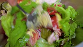 Salad preparation process. Process of mixing fresh salad
