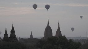 Bagan, Myanmar temple with baloon on the sky in sunrise.