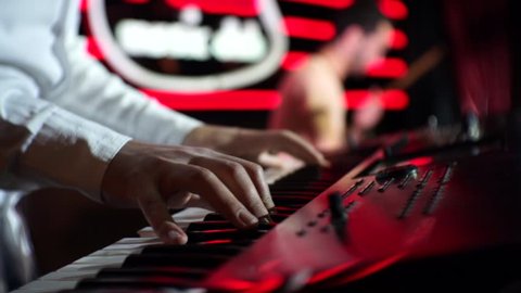 Disco Piano in Night Music Club, the hands of a musician playing the piano