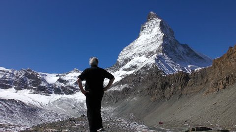 Switzerland - Sept 2017: View of confident male near Matterhorn Zermatt mountain holiday resort Bernese Oberland Switzerland Europe