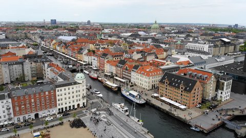 Aerial view of cityscape of Copenhagen, Nyhavn (famous historic district with canal and brightly coloured houses) - capital city of Denmark from above, Europe