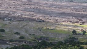 Long shot of  Plymouth houses destroyed by volcano eruption, Montserrat - Powered by Shutterstock - Get 15% off with code: PIKWIZARD15
