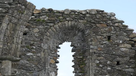 Glendalough , Ireland - May, 2016: Arched window of Stone Cathedral Ruin in Glendalough