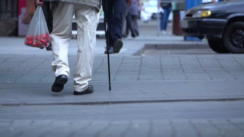 Old man walking  with cane