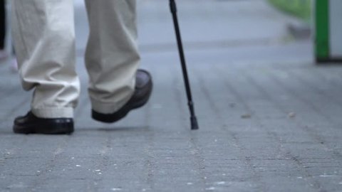 Old man walking  with cane