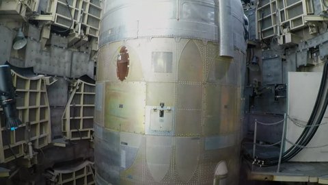 TUCSON, ARIZONA/USA- April 20, 2018: The camera tilts up to show a cold war era ICBM or Intercontinental Ballistic Missile in it's silo at Titan Missile Museum.